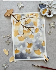 an art project with watercolor paints and leaves