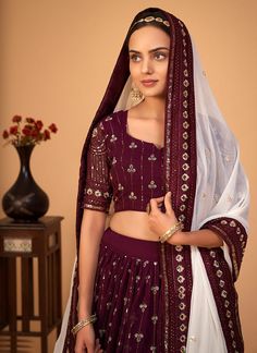 Maroon Sequence Wedding Lehenga Choli Shop Indian Wedding Lehenga In USA UK Canada With Free Shipping worldwide. an indian wear for festive or wedding events. This elegant set has a very pretty all over sequence work detailed with zari and thread embroidery on pure georgette lehenga with art silk lining paired with embellished georgette choli top and contrasting border and butti embellished georgette dupatta. Team this beautiful attire with golden pair of heels and statement jewellery to look li Wedding Lehenga Choli, Indian Wedding Lehenga, Georgette Lehenga, Embroidery Border, Party Wear Lehenga Choli, Fancy Wedding, Dressing Style, Party Wear Lehenga, Elegant Sets