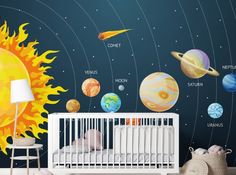 a baby's room with solar system wall decals