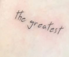 the word'the greatest'written in cursive font