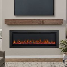 an electric fireplace in a living room with a flat screen tv on the wall above it