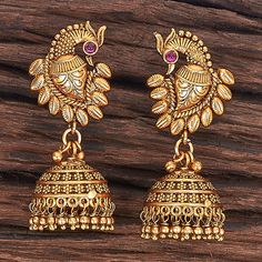 Antique Peacock Earring With Matte Gold Plating Height = 45 Mm || Width = 18 Mm Delicate Jhumki Antique Earring  The design and execution of this jhumkis are genuinely enchanting and sure to impress everyone. The goddess Laxmi scriptures makes this design bold and beautiful.We recommend wearing it for puja and special occasions with your favorite lehenga or silk sari. 100% Satisfaction Guarantee: Long Lasting Plating, High-Quality Stones. Gifting: This pair of charming earrings come in a beautif Luxury Jhumkas With Intricate Design, Kemp Jhumkas, Gold Indian Earrings, Earrings Gold Indian, Beautiful Gold Earrings, Gold Jhumka Earrings, Peacock Earrings, Jhumki Earrings, Bollywood Jewelry