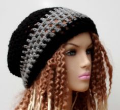 "Black and heather grey slouchy hat/small tam, vegan suitable in 100% acrylic. Created in a slouchy tam style and crocheted with open weave stitches, this beanieis warm and yet suitable to wear all year around. Let it sag in the back or tuck in your hair. Nice double loop stitches for stretch. Moderate length for any kind of hair, also great for long hair and moderate dreads. Width at brim 22\", stretches to 27\", cinches smaller with drawstring Length from crown to rim 9\" Widest point across 1 Black Slouchy Crochet Beanie Hat, Black Slouchy Crochet Hat For Winter, Black Slouchy Beanie, Slouchy Black Crochet Beanie, Trendy Slouchy Crochet Beanie Hat, Black Slouchy Crochet Hat, Handmade Black Beanie, Trendy Slouchy Crochet Hat, Trendy Slouchy Warm Hats