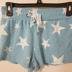 Printed Stars Shorts Spring Cotton Bottoms With Star Print, Cotton Bottoms With Star Print For Spring, Spring Star Print Cotton Bottoms, Casual Cotton Bottoms With Star Print, Blue Star Print Shorts, Cute Blue Shorts With Elastic Waistband, Blue Shorts With Star Print, Spring Cotton Shorts With Star Print, Cotton Star Print Shorts For Spring