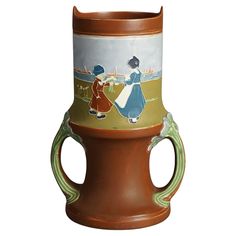 a brown vase with two women on it