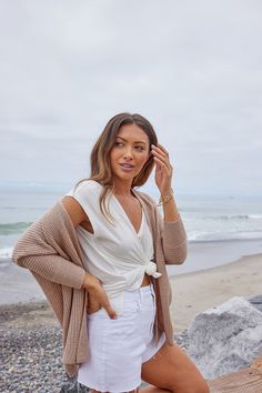 Details You can layer any basic piece with this super soft rib knit cardigan! Features include a drop shoulder, rib knit fabrication, and an open front. Style it over an essential neutral piece such as a cami, tank, or crop top and then pair it with white shorts and open toed sandals for a cute summer look. Lightweight & soft Dolman sleeve Drop shoulder Open front Rib knit Front ends lay open 100% Acrylic Color: Dark Beige Colors may vary on different viewing devices Size and fit Fits true to si Versatile Soft Knit Cardigan, Beige Ribbed Cardigan For Layering, Trendy Open Front Knit Top, Chic Ribbed Cardigan For Day Out, Soft Knit V-neck Cardigan For Day Out, Chic Open Front Tops For Layering, Neutral V-neck Cardigan For Layering, Versatile Open Front Tops For Day Out, Ribbed Cardigan For Everyday Spring Wear