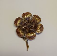 "Here is a large filigree ornate floral brooch. The brooch is hallmarked ART on the back of the brooch. It measures 2.5\" inches long by 1 7/8\" inches wide. Lovely detailing. Gift box included." Gold Flower Lapel Pin For Formal Occasions, Collectible Gold Filigree Brooches, Gold Filigree Brooches Collectible, Gold Flower Brooch Lapel Pin, Gold Filigree Brooches For Collectors, Gold Flower Brooch For Formal Occasions, Gold Flower Brooch For Party, Gold Flower Brooches For Party, Gold Flower-shaped Brooches For Gifts