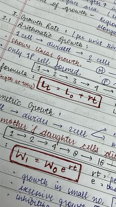 a close up of handwriting on top of a piece of paper with numbers and symbols