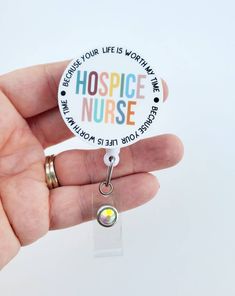 Hospice Badge Reel | Hospice Badge | Hospice Nurse | Cute Hospice Badge This colorful Hospice Badge Reel measures aprox 2 inches in with. It is printed on a hardboard and glued to a retractable badge reel. Teachers Office, Alligator Belt, Hospice Nurse, Diy Resin Projects, Non Ferrous Metals, Resin Projects, Carabiner Clip, Nurse Badge Reel, Nurse Badge