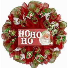 a wreath with santa claus on it and the words ho hoo written in red