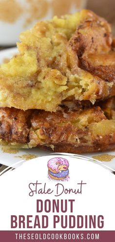 a stack of doughnut bread pudding sitting on top of a plate next to a cup