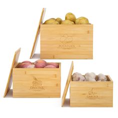 three wooden boxes filled with different types of vegetables and fruits in them, each containing potatoes