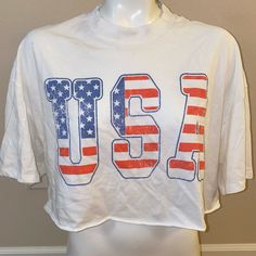 Size Xs Divided Brand Crop Top Light Weight Approximate Measurements: Underarm To Underarm: 25-30 Inches Underarm To Hem: 4 Inches Coller To Hem: 19 Inches See Photos Thank You For Looking White T-shirt With American Flag Print For Spring, Trendy Red Top With Flag Print, American Style White Tops For 4th Of July, Sporty Flag Print Summer Tops, White American Style Top For Spring, Sporty Summer Tops With Flag Print, Sporty White Tops With American Flag Print, White Patriotic Tops For Summer, Patriotic White Tops For Summer