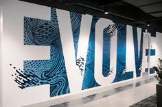 a large blue and white wall with the word love painted on it