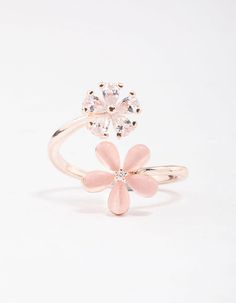 Warm up your stack with this gorgeous, rose gold cocktail ring. This ring features a spiral shaped silhouette, adorned with daisy motifs for a feminine finish. Dimensions: Diameter 18.5mm x Band Width 2mm | Lovisa Rose Gold Double Daisy Wrap Ring, Size: Medium/Large, Clear Rose Gold Cocktail, Spiral Shape, Gold Cocktail Ring, Gold Cocktail, Wrap Ring, Wrap Rings, Cocktail Ring, Cocktail Rings, Daisy