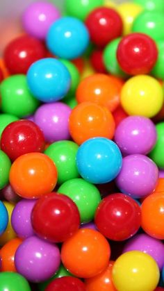 there are many different colored balls in the bowl