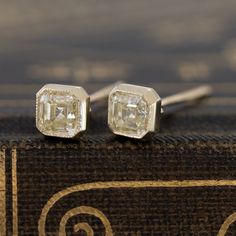 Sleek and elegant - the perfect hint of sparkle on the ears. The asscher cut diamonds were hand-selected by yours truly - the asschers have crisp faceting which simply draw your eyes in. Not to mention their beautiful, happy sunshine colors! Set in hand-crafted bezel settings and finished with delicate hand-applied milgrain. Low set on the lobes - just super chic! 18kt Yellow Gold Diamonds are natural and Earth-mined Simply Draw, Modern Mens Rings, Art Jewelry Earrings, Happy Sunshine, Asscher Cut Diamond, Antique Watches, Asscher Cut, Antique Engagement, Diamond Stud Earrings