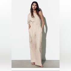 Brand New Chic Strapless Jumpsuit With Pockets For Summer, Chic Strapless Summer Jumpsuit With Pockets, Casual Asymmetrical Jumpsuits And Rompers, Asymmetrical Jumpsuits And Rompers For Summer Workwear, Asymmetrical Summer Jumpsuits And Rompers For Work, Chic Asymmetrical Jumpsuits And Rompers For Spring, Chic Beige Pantsuit For Summer, Chic Zara Jumpsuits And Rompers With Pockets, Chic Summer Pantsuit With Pockets