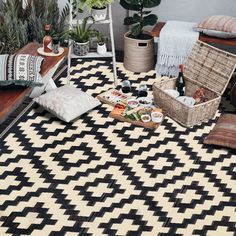 a black and white area rug with various items on it