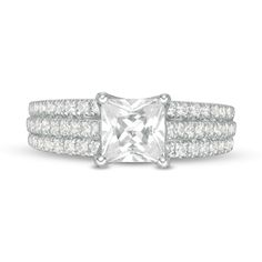 a princess cut diamond ring set with two rows of pave diamonds on each band