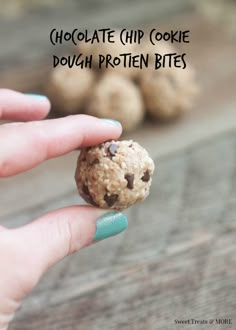 a hand holding a chocolate chip cookie dough protein bites