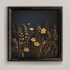 a painting with yellow flowers and green leaves on a black background is hanging on the wall