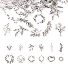 many different types of earrings on a white surface with one being cut out and the other is