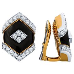 These beautiful and unique earrings from David Webb feature a black onyx center accented by approximately 0.75 carat total weight in round diamonds. They are set in 18 karat yellow gold and platinum with a clip on style back. The MSRP is approximately $21,000. These earrings are from the Manhattan Minimalism collection and are circa 1970. Condition: Excellent. No visible signs of wear. Earring Video, Geometric Bracelet, David Webb, Onyx Earrings, Madison Avenue, Enamel Earrings, Yellow Gold Earring, Onyx Stone, Yellow Diamond