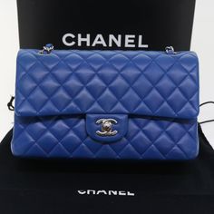 Nous parlons français - hablamos español. Brand: Chanel Model: Classic Flap Color: Blue Material: Leather Dimensions: W25cm x H12.5cm x D6cm Serial number: 22512308 Inclusions: Dust Bag / Item Box Country of origin: Italy Condition: New Introducing the Chanel "Classic" Shoulder Bag, an epitome of timeless elegance and sophistication. Crafted from luxurious blue lamb skin, this iconic piece reflects the brand's commitment to impeccable design. Expertly made in Italy, the current condition of the Classic Chanel Flap Bag, Navy Chanel Flap Bag, Vintage Classic Flap Chanel, Blue Chanel Bag, Royal Blue Chanel Bag, Trendy Purses, Chanel Brand, Chanel Model, Fendi Bags