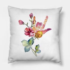 a watercolor painting of flowers on a white pillow