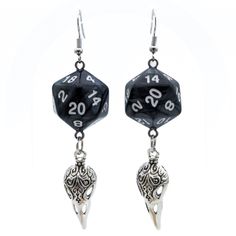 For Raven Queen worshippers who don't want to wear our huge and heavy (but very cool) raven earrings, we also offer this smaller, lighter (but still very cool) version. Each has a pearl black D20. Beneath the dice hang silvery raven skull charms. These would be a perfect accessory for someone playing a member of the shadar-kai or a cleric that worships the Raven Queen. A great gift for players of D&D, Pathfinder, and other tabletop RPGs -- or for anyone who wants to geek out with a fun and myste Black Skull Earrings For Gift, Black Fantasy Style Earrings, Black Fantasy Earrings, Black Fantasy Style Pierced Earrings, Nickel Free Black Skull Earrings, Black Fantasy Dangle Jewelry, Adjustable Black Skull Earrings, Adjustable Black Skull-shaped Earrings, Novelty Black Skull Earrings