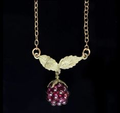 The bristly raspberry shrub, which grows in the cool northern regions of the US, is the bearer of fragrant and decorative berries. The delicate raspberry leaf has been revered by herbalists of many cultures through the ages for its therapeutic and medicinal uses. The raspberry necklace features cast bronze leaves and garnet beads of raspberry on a brass chain. 17-18" adjustable The unique process of creating molds directly from botanical elements results in jewelry that is not only striking but also true to nature. The color and material of these earrings, both bronze, lend a timeless elegance to any outfit. Be it for a special occasion or everyday wear, these earrings add a touch of sophistication and charm. Enjoy the beauty of nature with Michael Michaud. Raspberry Jewelry, Regions Of The United States, Raspberry Leaf, Michael Michaud, Acorn Pendant, Headpiece Accessories, Candle Cards, Body Stickers, Cluster Pendant