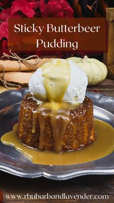 sticky butterbeeer pudding on a plate with caramel drizzle and whipped cream