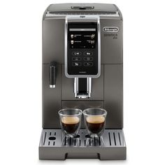 an image of a coffee machine with two glasses