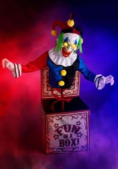 a creepy clown standing on top of a box