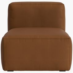 a brown couch sitting on top of a white floor