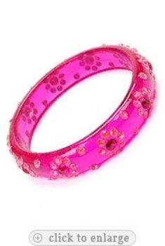 I am offering you this vintage rare dimensional   intense pink colored  Lucite bangle bracelet  with inset  colored  rhinestones. There is such fantastic color saturation in these stones, and the sparkle and light play is magnificent off this  bracelet !!  It measures app.  2   1/2  inches in diameter, and it is app.  1/2   inch wide.   The wonderful era of plastics is back,  all the rage now The Lucites, Bakelite's , and Celluloids are so in now, and really evoke an era that is so very highly s Pink Jeweled Bangle Bracelets, Pink Jeweled Bangle Bracelet, Pink Rhinestone Bangle Bracelets, Pink Rhinestone Bangle Bracelet, Pink Rhinestone Party Bracelets, Pink Crystal Bangle For Party, Lucite Bracelets, Bangle Bracelet, Favorite Jewelry