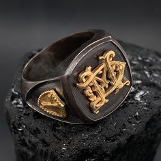 This unique Personalized Handcrafted Monogram Signet Ring is more like a work of art than a piece of jewelry. It can be customized with your initials in victorian style monogram lettering. The ring table measures 18mm in width and length. The ring is made of solid sterling silver with oxidized texture. The initials and the Knights Templar Crosses are made of solid 18k gold. The ring is custom made by order. Please confirm your finger size with the local jeweler before placing the order. You can Symbolic White Gold Rings For Ceremonial Occasions, Unique Engraved Formal Open Ring, Unique Engraved Open Ring For Formal Occasions, Unique Formal Engraved Open Ring, Luxury Handmade Engraved Ring For Anniversary, Symbolic White Gold Ceremonial Rings, Unique Polished Finish Signet Ring, Unique White Gold Signet Ring For Formal Occasions, Luxury Open Ring With Initials