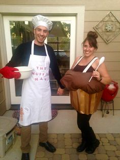 a man and woman dressed up in costumes standing next to each other on the front porch