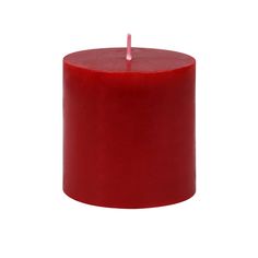 a red pillar candle with a single pink candle sticking out of it's center