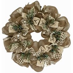 a wreath made out of burlock and mesh with bows on it's sides