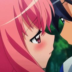 two anime characters one with pink hair and the other with blue eyes looking at each other