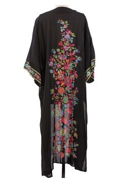 Instantly upgrade any ensemble with this floral-patterned ruana crafted from lightweight fabric for easy layering. 23" x 54" Open front 100% rayon Hand wash cold, line dry Imported Bohemian Black Printed Kimono, Black Printed Kimono For Festival, Black Bohemian Tunic Kimono, Black Printed Kaftan For Festival, Black Long Kaftan One Size, Black Shawl Kimono For Spring, Long Rayon Kaftan For Spring, Spring Long Rayon Kaftan, Black Flowy Bohemian Kimono