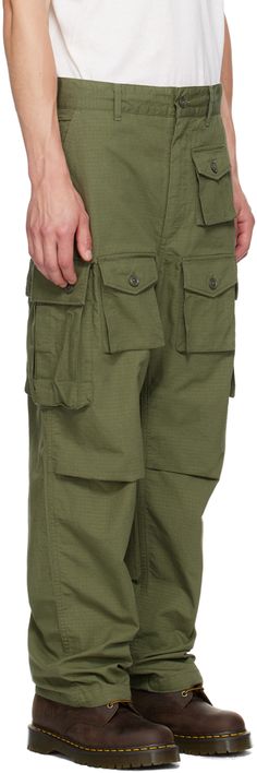 Cotton ripstop cargo pants. · Belt loops · Concealed drawstring at waistband and cuffs · Four-pocket styling · Zip-fly · Flap pockets at front · Tucks at knees Available exclusively at SSENSE. Supplier color: Olive Combat Cargo Pants With Pockets, Military-style Relaxed Fit Bottoms With Pockets, Khaki Utility Cargo Shorts With Patch Pockets, Military Style Bottoms With Pockets And Relaxed Fit, Military Style Relaxed Fit Bottoms With Pockets, Tapered Leg Parachute Pants With Patch Pockets For Outdoor, Outdoor Parachute Pants With Patch Pockets And Tapered Leg, Green Military Parachute Pants With Side Pockets, Military Style Parachute Pants With Side Pockets