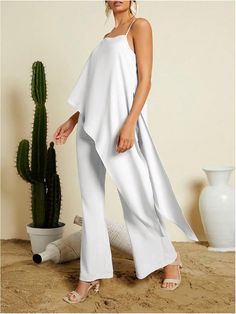 Unleash your inner goddess in our Cascading Goddess Sleeveless 2pc Layer Jumpsuit! With its layered design and flowing silhouette, this jumpsuit exudes femininity and elegance. Perfect for any occasion, you'll feel confident and empowered in this chic and versatile piece. Embrace your unique style and make a statement today! 100% Polyester Care instructions Hand/Machine Wash Brand Size Dress Bust Waist Hip XS 0-2 31-32.5'' 23-24'' 31-34" S 4--6 33-35'' 25-26'' 35-37" M 8--10 35-36'' 27-28'' 38-3 Elegant Sleeveless Two-piece Set, Sleeveless Evening Sets For Spring, Spring Evening Sleeveless Sets, Elegant Two-piece Beach Set, Chic Sleeveless Party Sets, Elegant Sleeveless Strapless Jumpsuit For Beach, Elegant Sleeveless Beachwear Sets, White Sleeveless Evening Sets, Chic Sleeveless Flowy Jumpsuits And Rompers