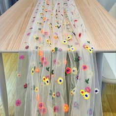 the sheer curtains are decorated with flowers and butterflies