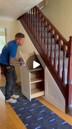 a man standing in front of a stair case