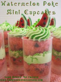 watermelon poke mini cupcakes in plastic cups with green frosting on top