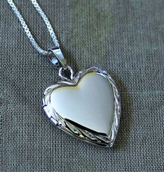 Sterling Silver Heart Locket Necklace  by HeartworksByLori on Etsy, $40.00 Silver Locket Necklace For Mother's Day Anniversary, Nickel-free Locket Necklace For Anniversary On Valentine's Day, Silver Heart Pendant Locket Necklace With Hallmark, Classic Heart Locket Necklace, Valentine's Day Sterling Silver Locket Necklace, Valentine's Day Sterling Silver Round Pendant Locket, Valentine's Day Sterling Silver Round Locket Necklace, Valentine's Day Sterling Silver Round Pendant Locket Necklace, Classic Heart Pendant Locket Necklace