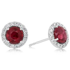 14K white gold ruby and diamond earrings from the Reis-Nichols Collection. The earrings feature two round rubies weighing over 2 ctw and 32 round brilliant cut diamonds weighing approximately 1/3 ctw. Halo Earrings Studs, Ruby Diamond, Round Brilliant Cut Diamond, Halo Diamond, Ruby, Halo, Diamond Earrings, Gems, White Gold